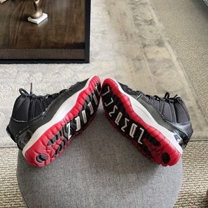 Kids Jordan’s bred 4 practically new used 2 times